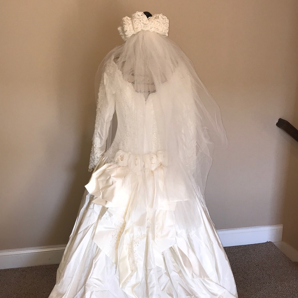 Mori Lee ivory long sleeve bead and lace gown